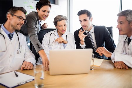 simsearch:6109-06006486,k - Medical team having a meeting at the office Stock Photo - Premium Royalty-Free, Code: 6109-08488865