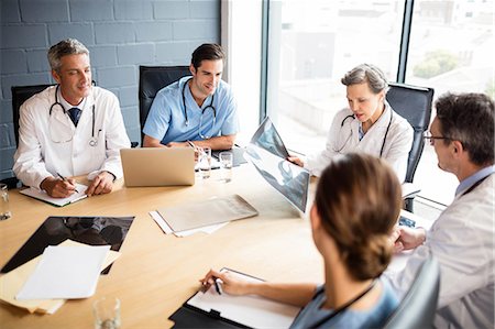 simsearch:6109-08488902,k - Medical team having a meeting at the hospital Stock Photo - Premium Royalty-Free, Code: 6109-08488896