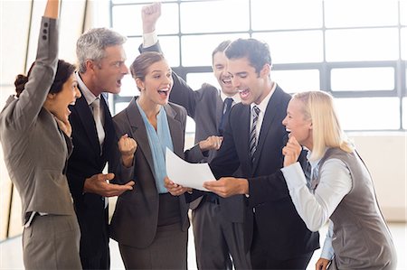 simsearch:6109-06002803,k - Business team cheering and shouting at the office Stock Photo - Premium Royalty-Free, Code: 6109-08488807