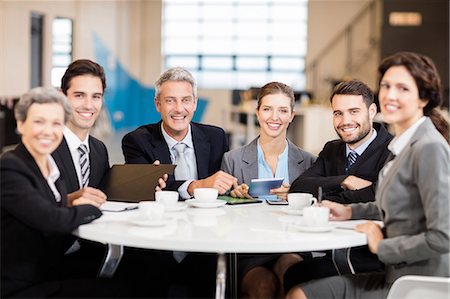 simsearch:6109-08394968,k - Business team having a meeting at the office Stock Photo - Premium Royalty-Free, Code: 6109-08488822