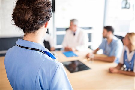 simsearch:6109-08488900,k - Medical team having a meeting at the hospital Stock Photo - Premium Royalty-Free, Code: 6109-08488924