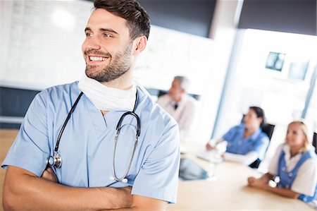 simsearch:6109-08488902,k - Medical team having a meeting at the hospital Stock Photo - Premium Royalty-Free, Code: 6109-08488929