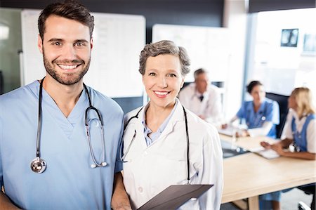 simsearch:6109-08488902,k - Medical team having a meeting at the hospital Stock Photo - Premium Royalty-Free, Code: 6109-08488931