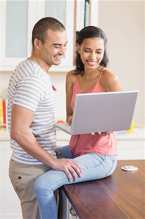 simsearch:6109-08489003,k - Smiling couple using laptop in the kitchen at home Stockbilder - Premium RF Lizenzfrei, Bildnummer: 6109-08489047
