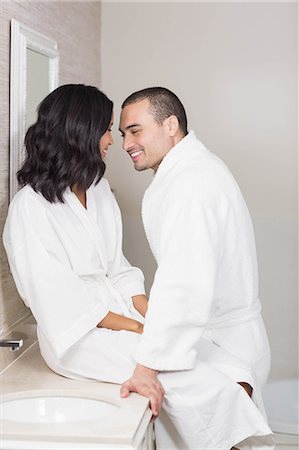 simsearch:6109-08489796,k - Smiling couple in bathrobe about to kiss in bathroom Photographie de stock - Premium Libres de Droits, Code: 6109-08489213