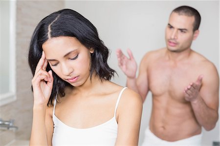 Unhappy young couple arguing in bathroom Stock Photo - Premium Royalty-Free, Code: 6109-08489228