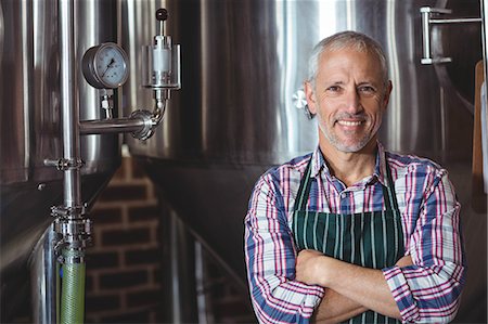 simsearch:6109-08489288,k - Serious brewer looking at camera at the local brewery Stock Photo - Premium Royalty-Free, Code: 6109-08489401