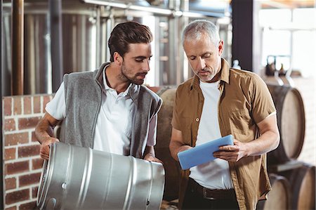 simsearch:6109-08489288,k - Team of brewers working together at the local brewery Stock Photo - Premium Royalty-Free, Code: 6109-08489407