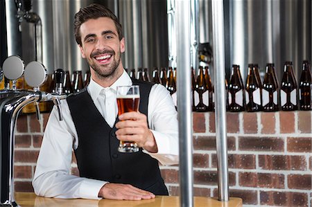 Barman giving a beer in a pub Stock Photo - Premium Royalty-Free, Code: 6109-08489549