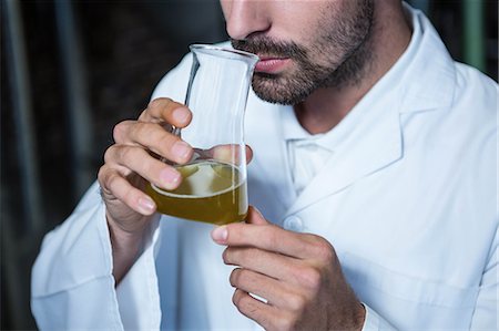 simsearch:6109-08489715,k - Focused brewer testing his beer in the brewery factory Stock Photo - Premium Royalty-Free, Code: 6109-08489573