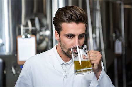 simsearch:400-04853000,k - Focused brewer testing his beer at the microbrewery Stock Photo - Premium Royalty-Free, Code: 6109-08489571