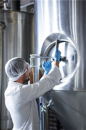 Focused brewer working in the plant at the local brewery Stock Photo - Premium Royalty-Free, Code: 6109-08489594