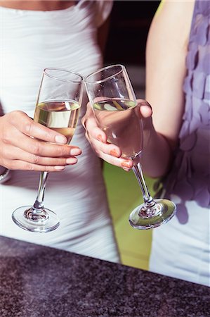 simsearch:400-04040205,k - Young women toasting champagne flute in bar Stock Photo - Premium Royalty-Free, Code: 6109-08489735