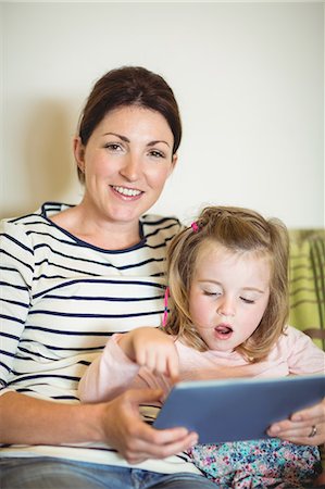 simsearch:6109-08390544,k - Mother and daughter on tablet on couch Stock Photo - Premium Royalty-Free, Code: 6109-08434668