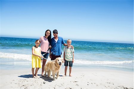 simsearch:6109-08434823,k - Cute family walking the dog on the beach Stock Photo - Premium Royalty-Free, Code: 6109-08434767