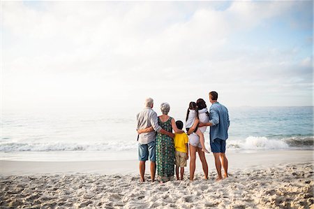 simsearch:6109-08434823,k - Cute family facing the sea on the beach Stock Photo - Premium Royalty-Free, Code: 6109-08434884