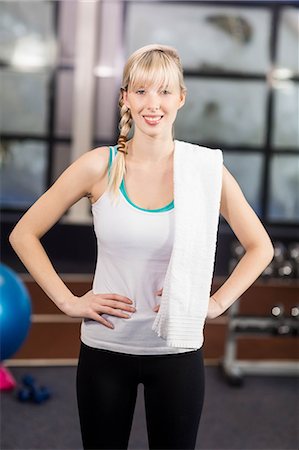 simsearch:6109-08435609,k - Smiling woman posing with hands on hips at the leisure center Stockbilder - Premium RF Lizenzfrei, Bildnummer: 6109-08435016