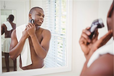 Handsome man about to shave in the bathroom Stock Photo - Premium Royalty-Free, Code: 6109-08435211