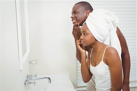 simsearch:6109-08435535,k - Ethnic couple getting ready in the bathroom Stock Photo - Premium Royalty-Free, Code: 6109-08435231