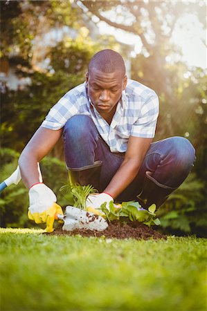 simsearch:6109-08435446,k - Handsome man doing some gardening outside Stock Photo - Premium Royalty-Free, Code: 6109-08435440