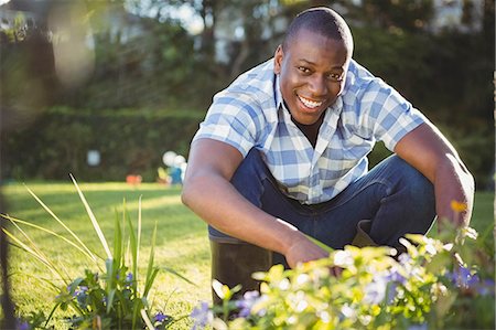 simsearch:6109-08435446,k - Handsome man doing some gardening outside Stock Photo - Premium Royalty-Free, Code: 6109-08435449