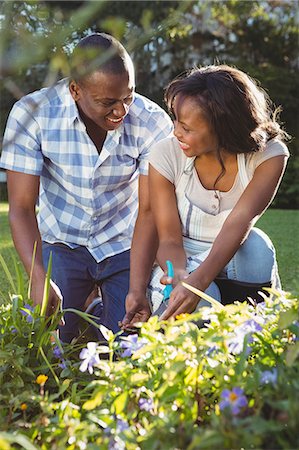 simsearch:6109-08435324,k - Ethnic couple doing some gardening outside Stock Photo - Premium Royalty-Free, Code: 6109-08435455