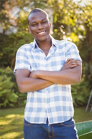 simsearch:6109-08435446,k - Handsome man crossing his arms in the garden Stock Photo - Premium Royalty-Free, Code: 6109-08435418