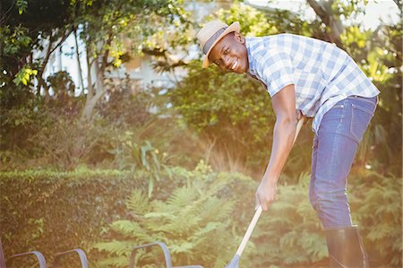 simsearch:6109-08435446,k - Handsome man doing some gardening outside Stock Photo - Premium Royalty-Free, Code: 6109-08435423