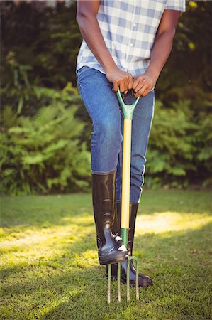 simsearch:6109-08435446,k - Handsome man doing some gardening outside Stock Photo - Premium Royalty-Free, Code: 6109-08435426