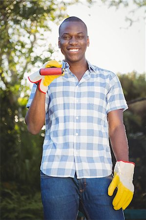 simsearch:6109-08435446,k - Handsome man doing some gardening outside Stock Photo - Premium Royalty-Free, Code: 6109-08435432