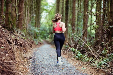 simsearch:400-07688341,k - Pretty blonde woman running in the forest Stock Photo - Premium Royalty-Free, Code: 6109-08435684