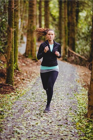 simsearch:6109-08435603,k - Fit brunette make a run in the woods Stock Photo - Premium Royalty-Free, Code: 6109-08435608