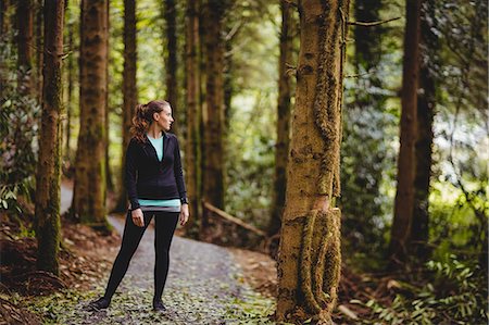 simsearch:6109-08435603,k - Fit brunette taking a break in the woods Stock Photo - Premium Royalty-Free, Code: 6109-08435609