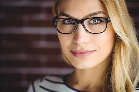 stylish - Portrait of beautiful blonde woman on brick wall Stock Photo - Premium Royalty-Free, Code: 6109-08435812