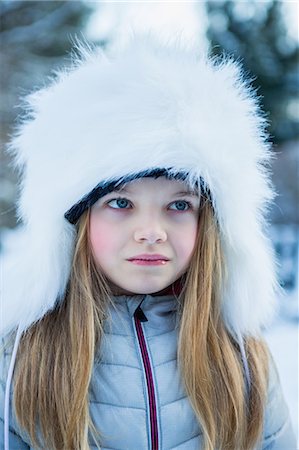 Portrait of cute girl in winter clothes on a beautiful snowy day Stock Photo - Premium Royalty-Free, Code: 6109-08435823