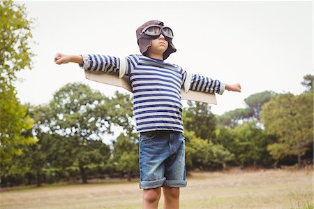 false - Little boy with airplane wings Stock Photo - Premium Royalty-Free, Code: 6109-08581371