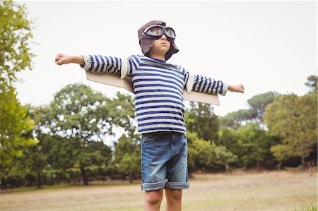 phony - Little boy with airplane wings Stock Photo - Premium Royalty-Free, Code: 6109-08581371