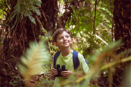 Little boy exploring in nature Stock Photo - Premium Royalty-Free, Code: 6109-08581374