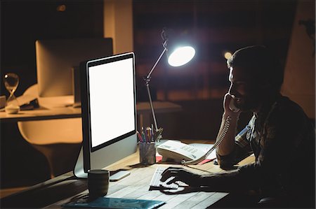 exhausted - Businessman making a phone call at night Stock Photo - Premium Royalty-Free, Code: 6109-08581402