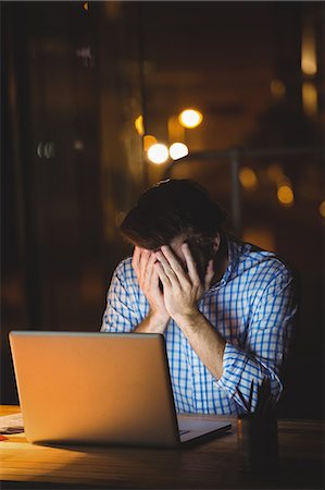 stress employees - Overworked businessman working at night Stock Photo - Premium Royalty-Free, Code: 6109-08581408