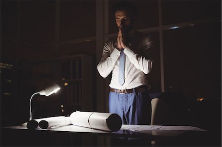 stressed guy working late - Overworked businessman working at night Stock Photo - Premium Royalty-Free, Code: 6109-08581424