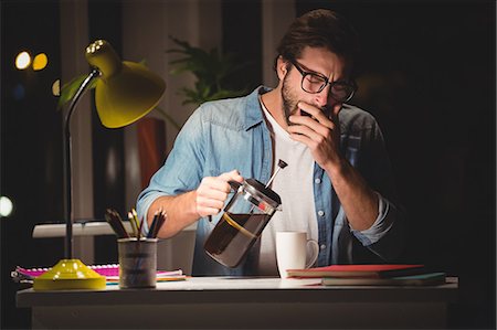 simsearch:6109-08581492,k - Hipster serving coffee and yawning Stock Photo - Premium Royalty-Free, Code: 6109-08581438