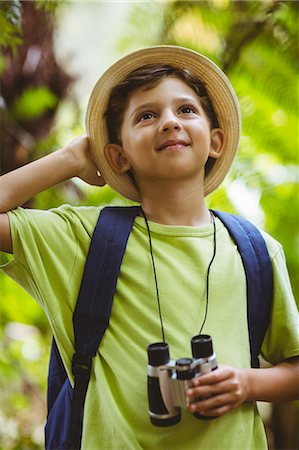 explore vacation - Happy boy holding binoculars Stock Photo - Premium Royalty-Free, Code: 6109-08581898