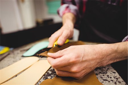 simsearch:6113-06753267,k - Close up of hands holding leather Stock Photo - Premium Royalty-Free, Code: 6109-08582142