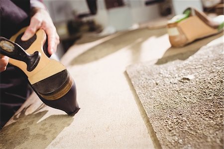 Close up of hands making a shoe Stock Photo - Premium Royalty-Free, Code: 6109-08582216