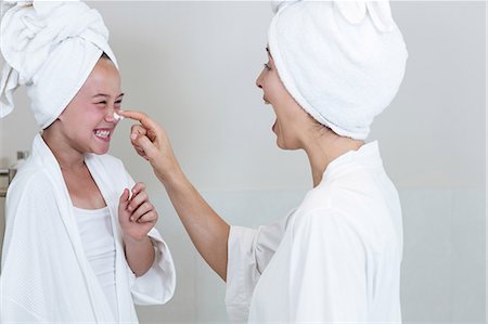 skin child - Mother applying moisturizer on daughters nose Stock Photo - Premium Royalty-Free, Code: 6109-08536479