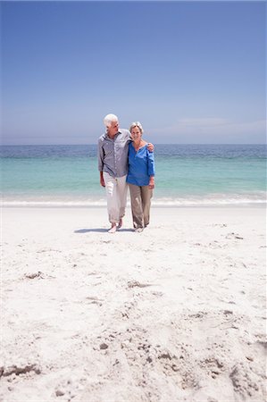 simsearch:6109-08536505,k - Senior couple walking on the beach Stock Photo - Premium Royalty-Free, Code: 6109-08536509