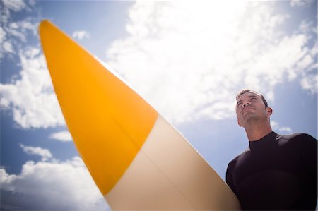 surferos - Surfer holding surfboard on beach Foto de stock - Sin royalties Premium, Código: 6109-08536520