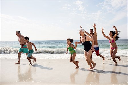 elderly woman daughter - Happy family running on beach Stock Photo - Premium Royalty-Free, Code: 6109-08536526