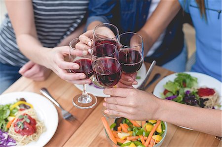 simsearch:6109-08804832,k - Friends toasting glass of red wine while having meal Stock Photo - Premium Royalty-Free, Code: 6109-08536662